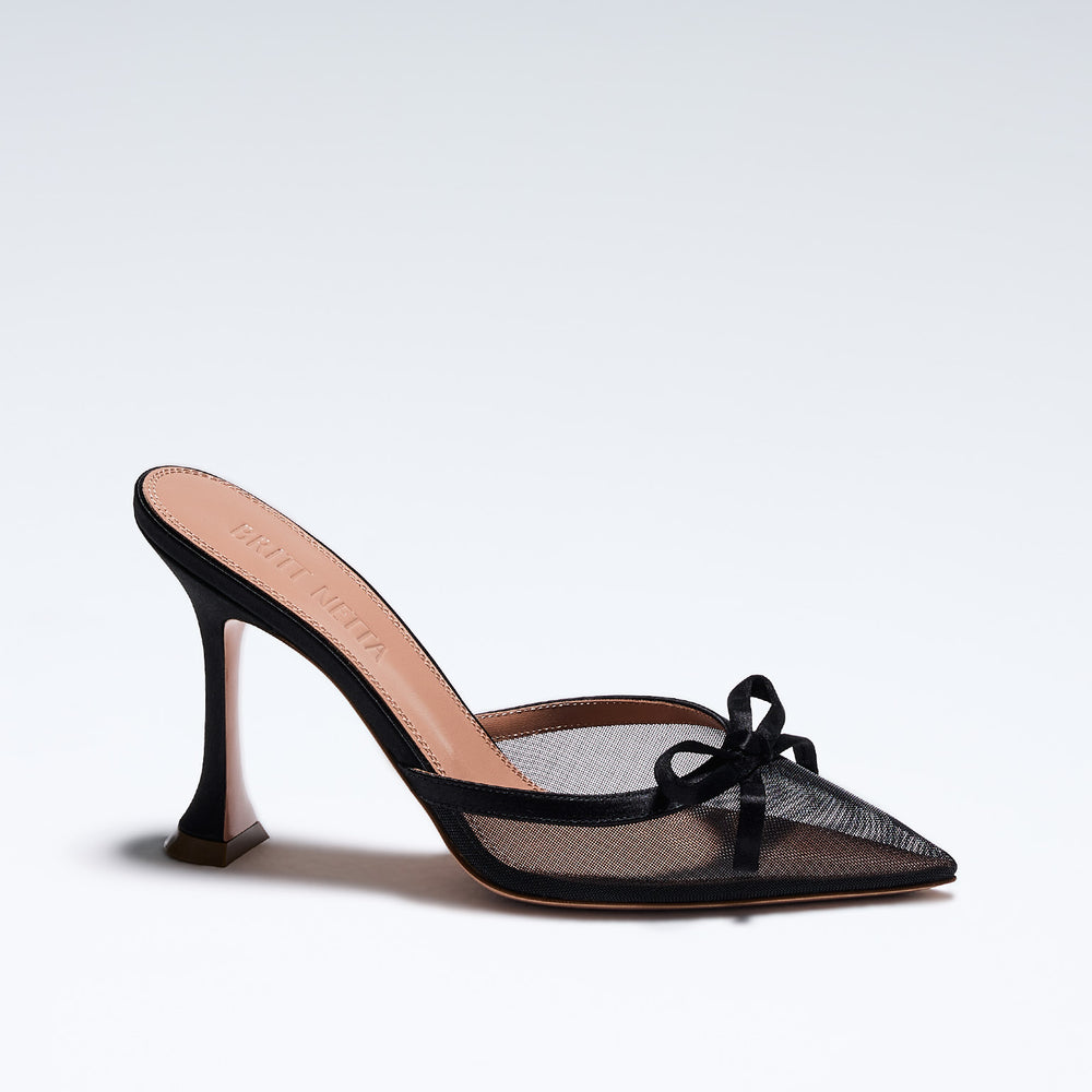 Hand-crafted in Italy, the Amelia (“Amelia”) mule features a glossy black satin and is set upon our custom 95mm heel designed for your comfort. Amelia is accented with our signature mesh upper that gently molds to your foot and features an elegant satin bow making it the perfect addition to your wardrobe this holiday season.