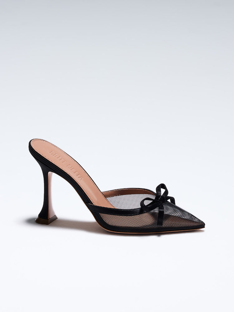 Hand-crafted in Italy, the Amelia (“Amelia”) mule features a glossy black satin and is set upon our custom 95mm heel designed for your comfort. Amelia is accented with our signature mesh upper that gently molds to your foot and features an elegant satin bow making it the perfect addition to your wardrobe this holiday season.