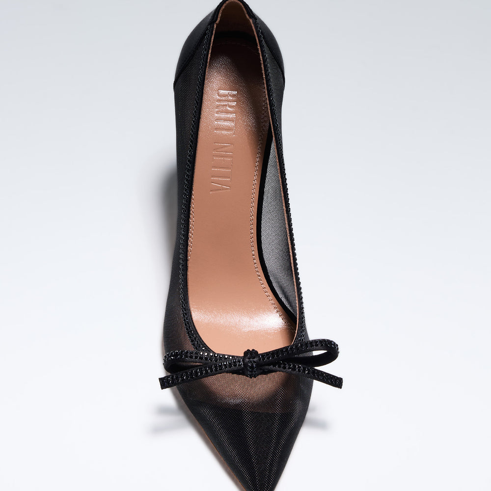 
                      
                        Hand-crafted in Italy, the Cinderella (“Cinderella”) pump features a glossy black satin and is set upon our custom 95mm heel designed for your comfort. Cinderella is accented with our signature mesh upper that gently molds to your foot and features a bold bow that is embellished with glittering Swarovski crystals.
                      
                    