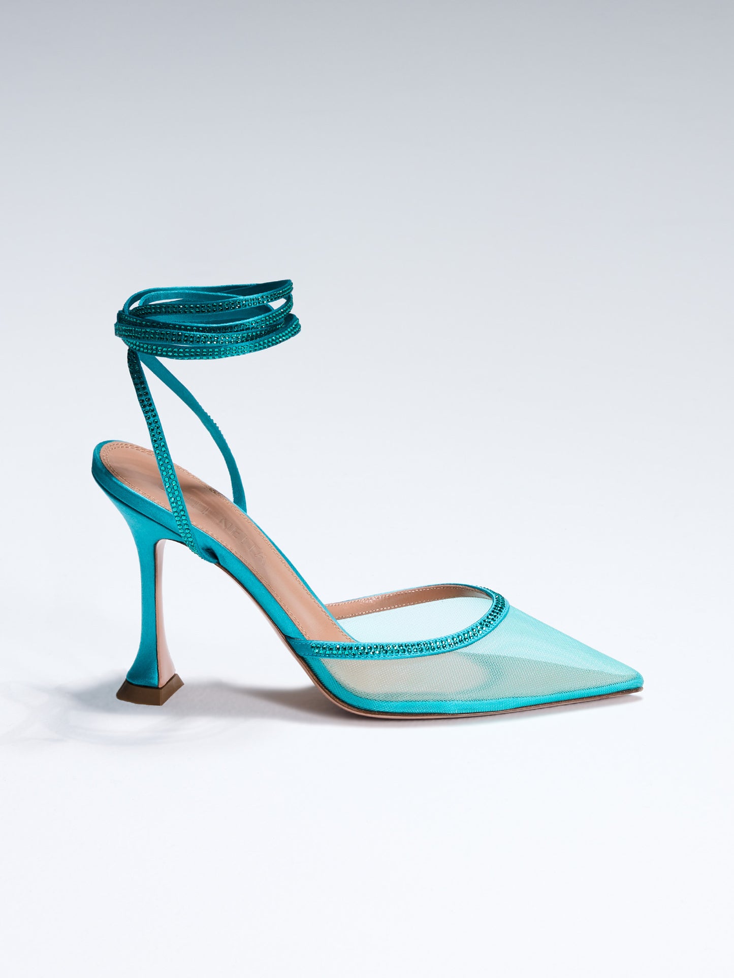 Dani Lace up on Model. TEAL SATIN LACE-UP WITH CRYSTAL EMBELLISHMENT Hand-crafted in Italy, the Dani (“Dani”) lace-up features a glossy teal satin and is set upon our custom 95mm heel designed for your comfort. Dani is accented with our signature mesh upper that gently molds to your foot and is adorned with rows of glistening crystals that wrap around your foot and leg for an irresistible touch of sparkle.